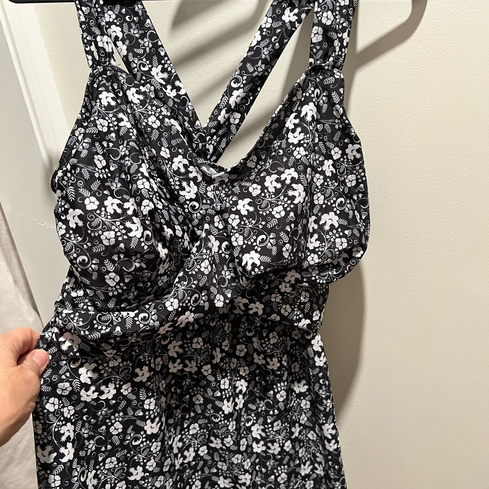 Black and White Floral Halter tankini with black swim shorts.  Sold as a set.